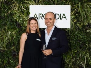 Arcadia celebrates their fifth birthday! Anna Longley and Anthony Pangallo with green wall